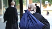 barristers arriving at NSW supreme court to battle over a liquidation